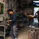Two young men work in a metal-crafting shop in Sidi Bouzid. Unemployment in interior cities like this is around 30%.